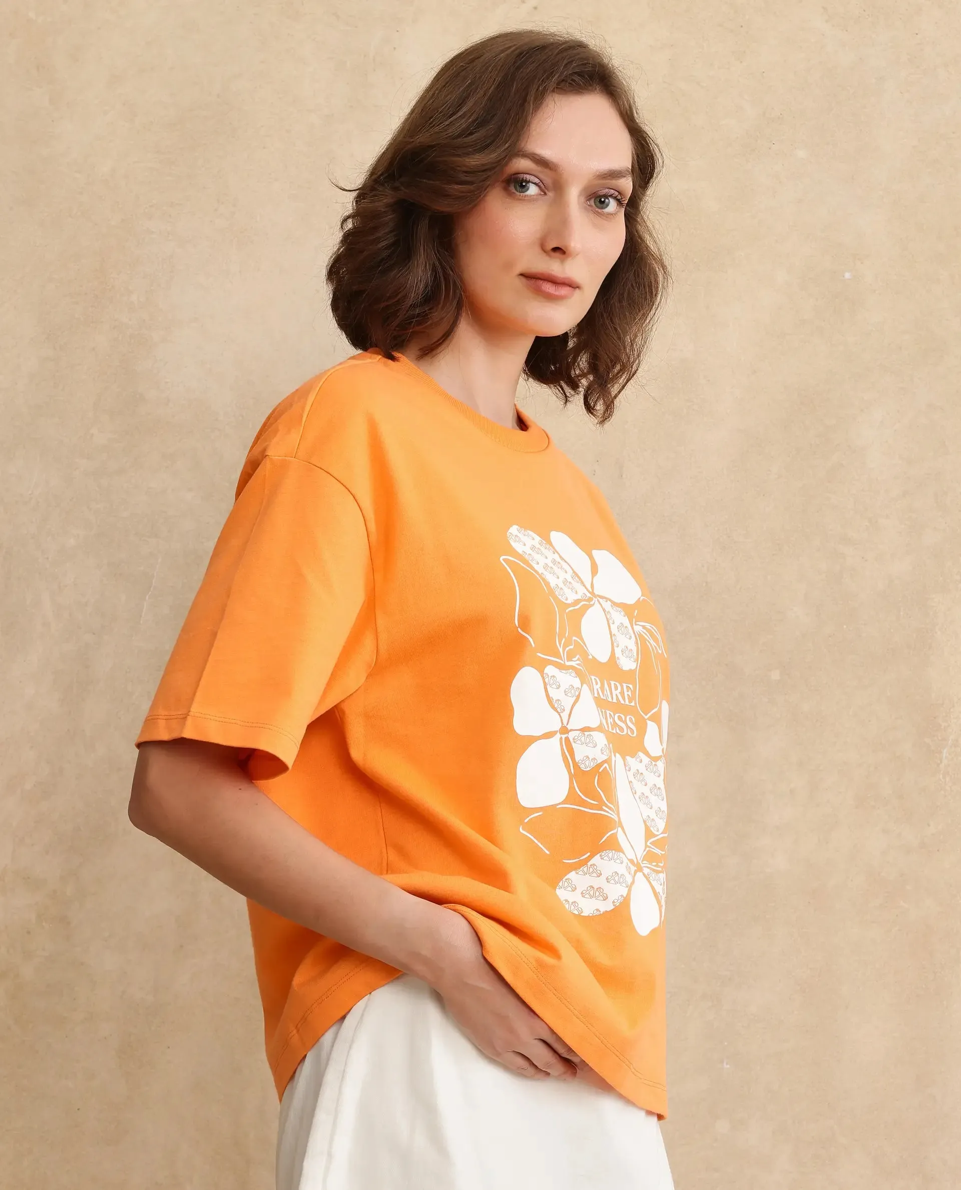 Rareism Women Stunt Orange Cotton Blend Fabric Short Sleeve Crew Neck Oversized Fit Graphic Print T-Shirt